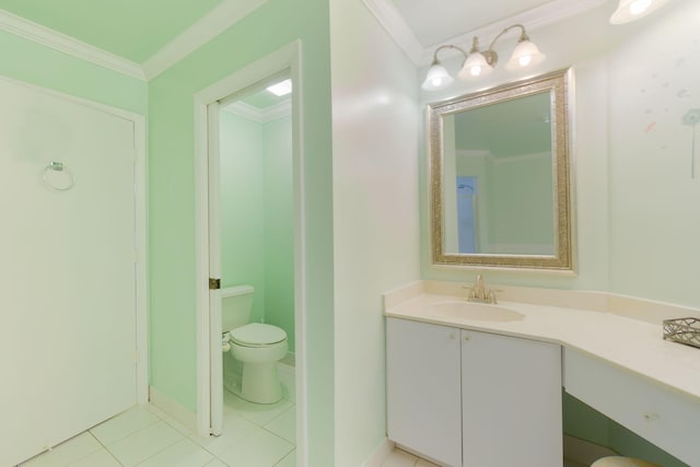 bathroom with tile patterned floors, vanity, toilet, and ornamental molding