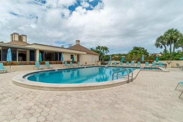 view of swimming pool featuring a patio