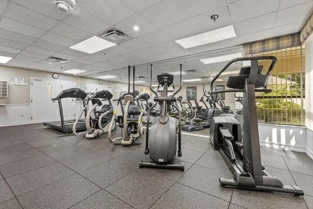 workout area featuring a paneled ceiling