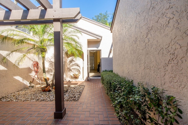 view of side of home with a pergola