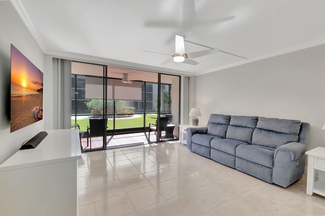 tiled living room with ceiling fan and crown molding