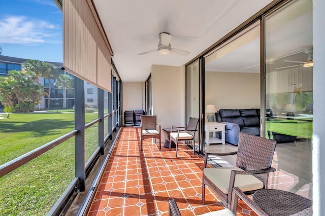 sunroom / solarium featuring ceiling fan