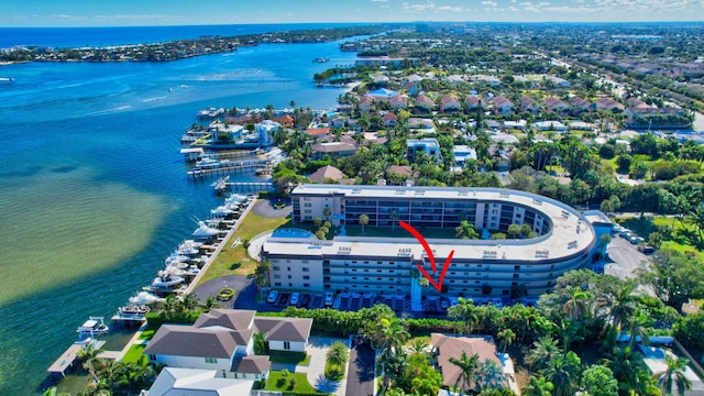 birds eye view of property with a water view