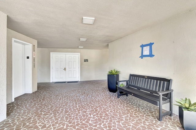 interior space featuring a textured ceiling