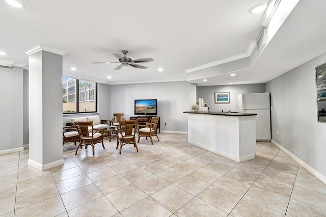 interior space featuring ceiling fan, light tile patterned floors, and crown molding