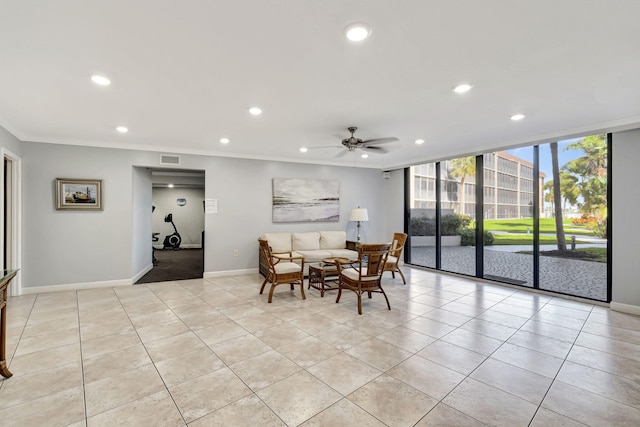 tiled dining room with ceiling fan and crown molding