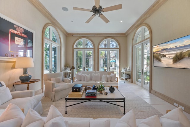 tiled living room featuring french doors, ceiling fan, and ornamental molding