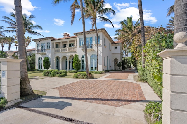 mediterranean / spanish-style house featuring a balcony