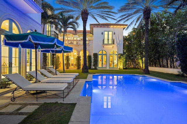 view of pool with a patio area and french doors