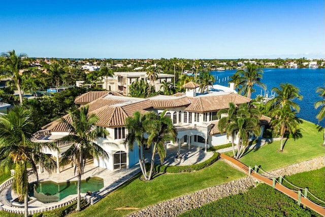 birds eye view of property with a water view