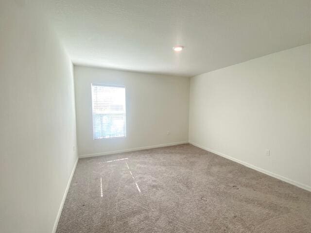 empty room featuring carpet flooring