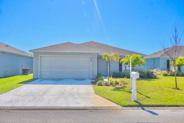 ranch-style house with central AC unit, a garage, and a front lawn