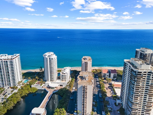 birds eye view of property featuring a view of city and a water view