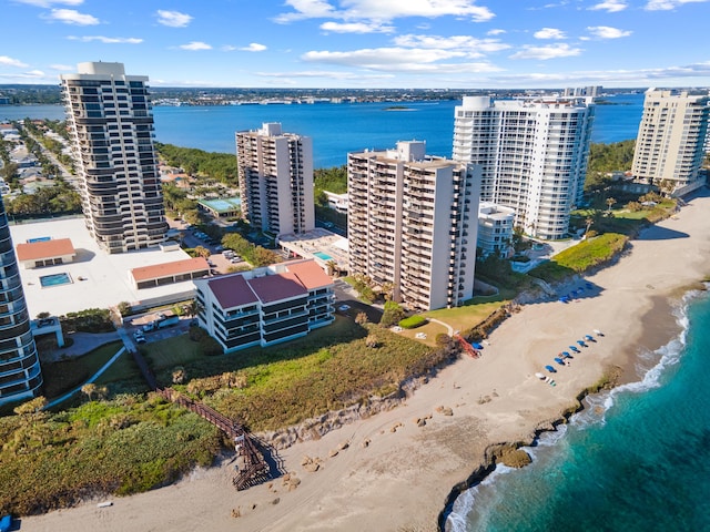 aerial view with a beach view and a water view