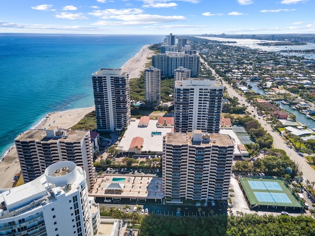 bird's eye view featuring a water view, a view of city, and a view of the beach