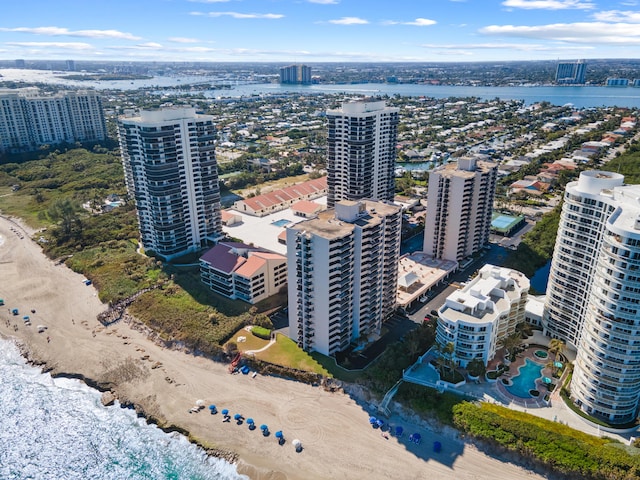 birds eye view of property featuring a city view and a water view