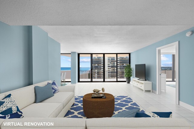 dining area featuring expansive windows, ceiling fan, a water view, and a textured ceiling