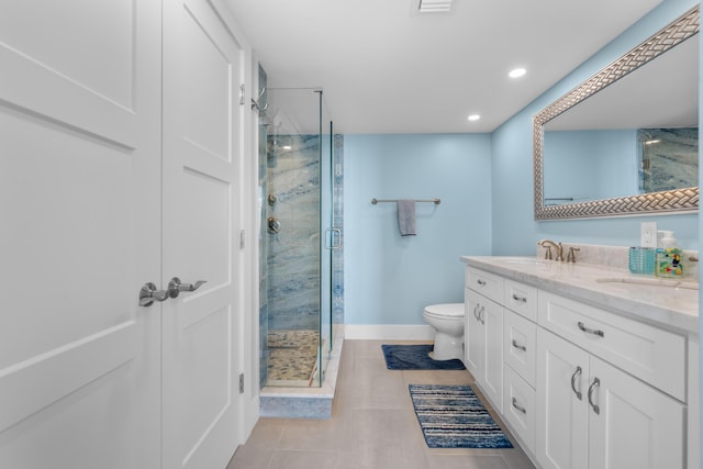 full bathroom with tile patterned floors, a sink, toilet, and a shower stall