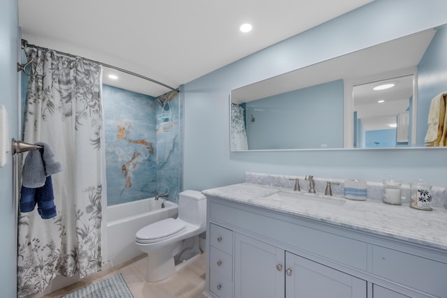 bathroom featuring toilet, recessed lighting, shower / bath combo with shower curtain, and vanity