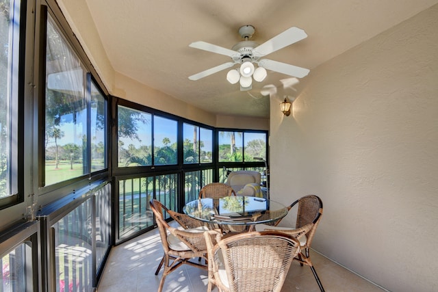 sunroom featuring plenty of natural light and ceiling fan