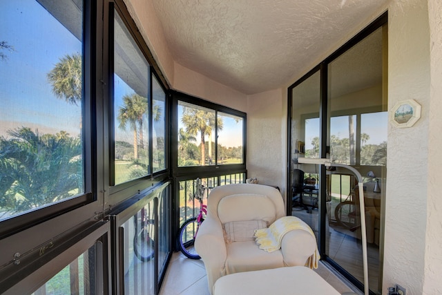 sunroom / solarium featuring a healthy amount of sunlight