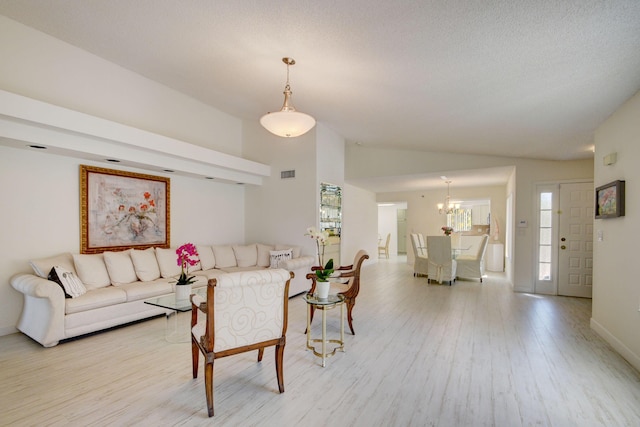 7230 Clunie Pl Unit 15403, Delray Beach, FL 33446 - living room with wood finished floors, a chandelier, lofted ceiling, and baseboards