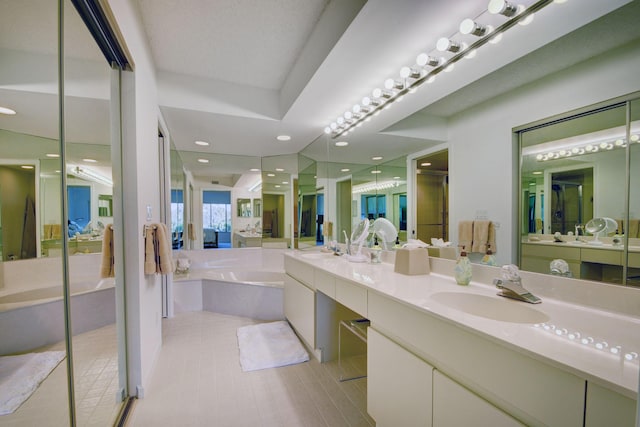 7230 Clunie Pl Unit 15403, Delray Beach, FL 33446 - full bathroom featuring a bath, double vanity, a shower stall, ensuite bath, and recessed lighting