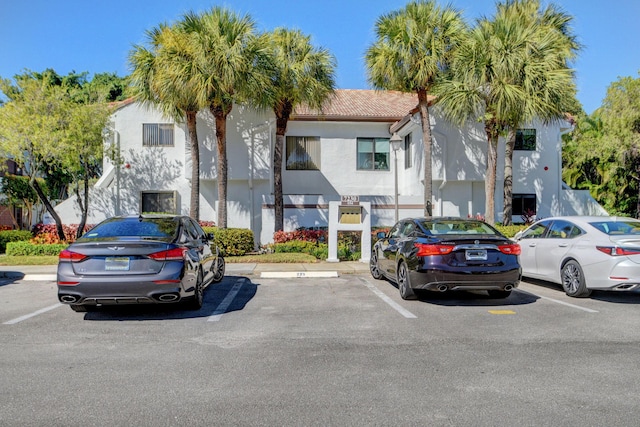 7230 Clunie Pl Unit 15403, Delray Beach, FL 33446 - view of building exterior with uncovered parking