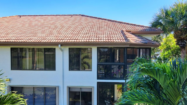 7230 Clunie Pl Unit 15403, Delray Beach, FL 33446 - view of home's exterior featuring a tile roof and stucco siding