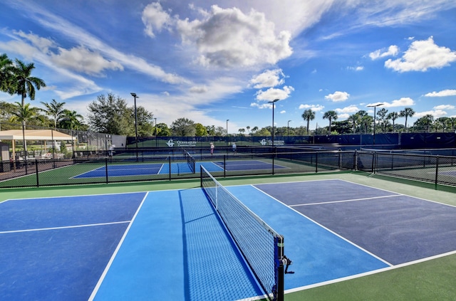 view of tennis court featuring basketball court