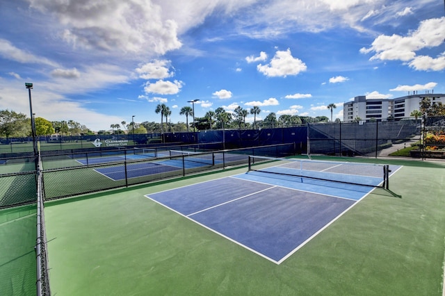 view of tennis court featuring basketball court