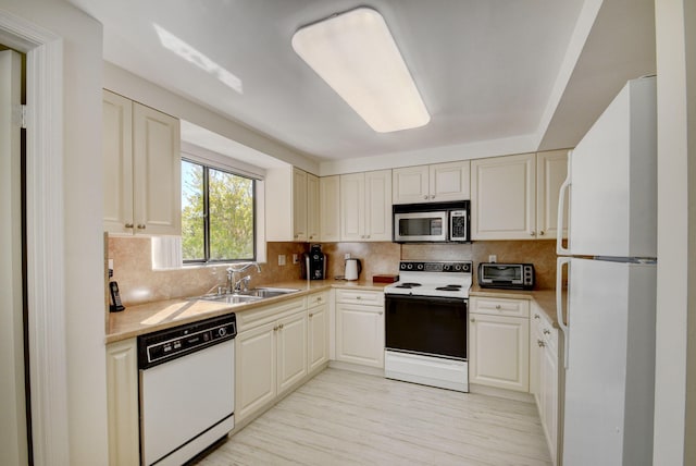 7230 Clunie Pl Unit 15403, Delray Beach, FL 33446 - kitchen featuring white appliances, a sink, light countertops, light wood-type flooring, and tasteful backsplash