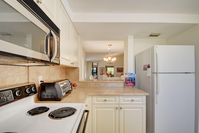 7230 Clunie Pl Unit 15403, Delray Beach, FL 33446 - kitchen featuring white appliances, a chandelier, tasteful backsplash, white cabinetry, and light countertops