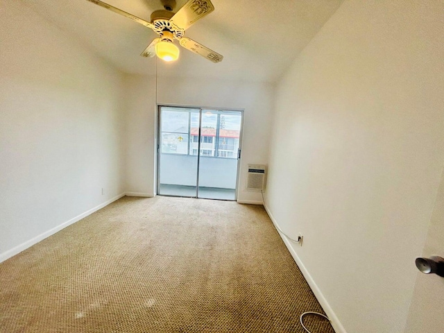 unfurnished room with light carpet, a wall unit AC, ceiling fan, and lofted ceiling