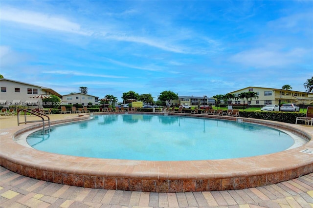 view of pool featuring a patio