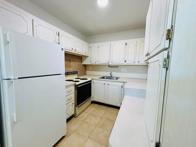 kitchen featuring white cabinetry, sink, tasteful backsplash, white appliances, and light tile patterned floors