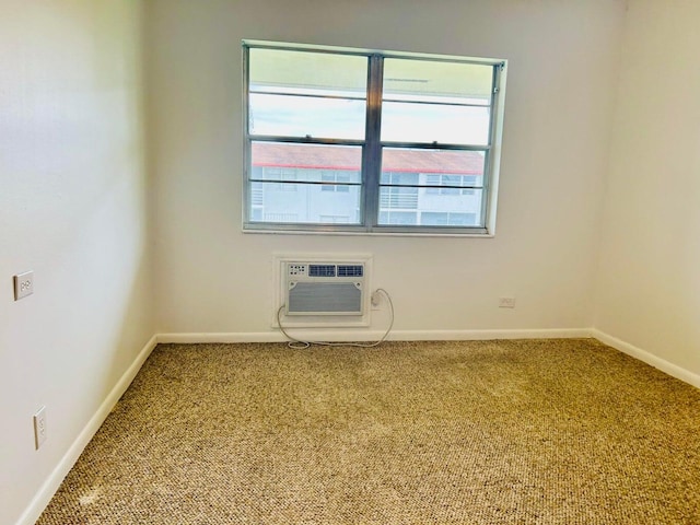 carpeted spare room with a wall mounted AC