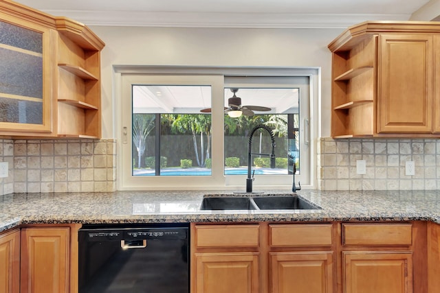 kitchen featuring ceiling fan, sink, light stone counters, and black dishwasher