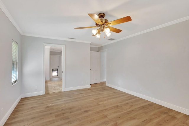 unfurnished bedroom featuring light hardwood / wood-style flooring, ceiling fan, and ornamental molding