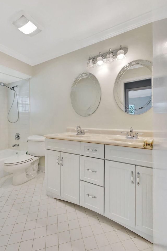 full bathroom with tile patterned flooring, vanity, tiled shower / bath, and crown molding