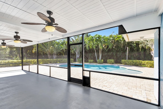 view of swimming pool featuring ceiling fan