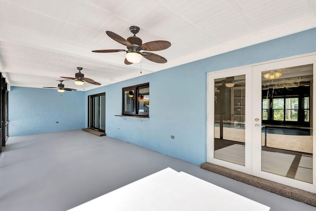 view of patio featuring ceiling fan and french doors