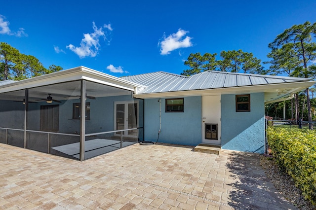 back of property featuring a patio, ceiling fan, and a sunroom