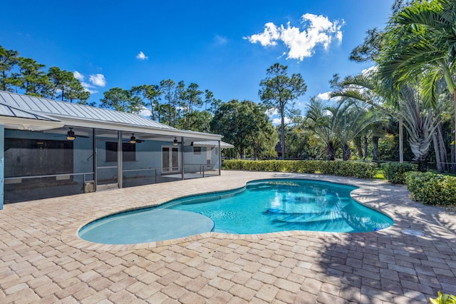 view of pool featuring ceiling fan and a patio