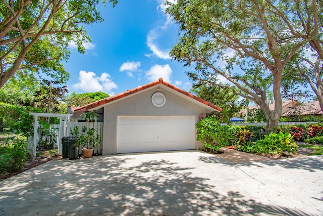 view of property exterior featuring a garage