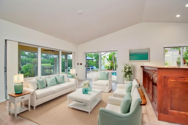 living room with plenty of natural light and lofted ceiling