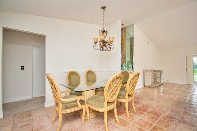 dining area with a notable chandelier and lofted ceiling