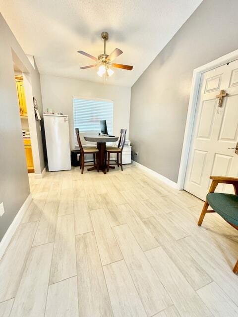 interior space featuring ceiling fan and light wood-type flooring