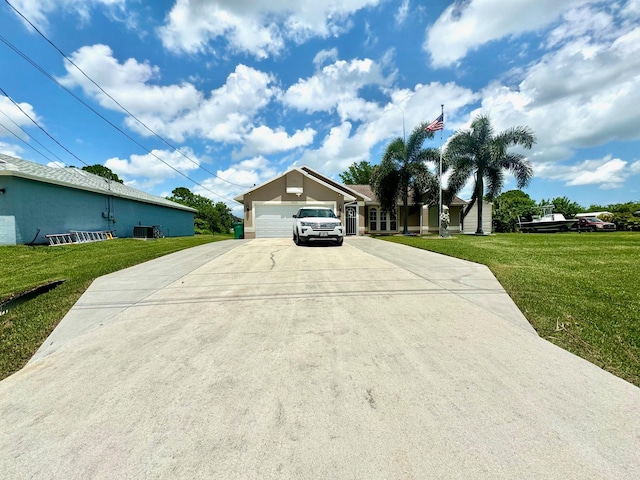 view of front of house with central AC unit, a front yard, and a garage