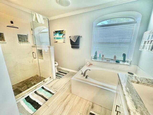 full bathroom featuring vanity, separate shower and tub, crown molding, hardwood / wood-style flooring, and toilet